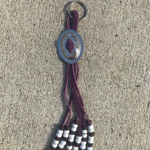 Purple suede fringe silver concho keychain